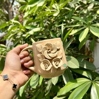 Handcrafted Beige Ceramic Mug with Embossed Floral Design