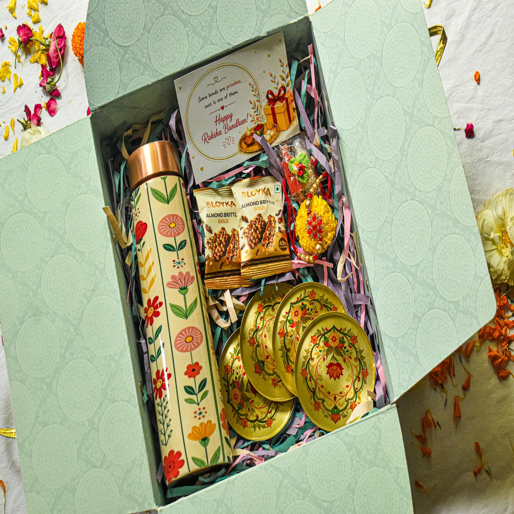 Premium Rakhi Gift Box- Phoolkari Copper Bottle +Brass Coaster Floral Set Of 4