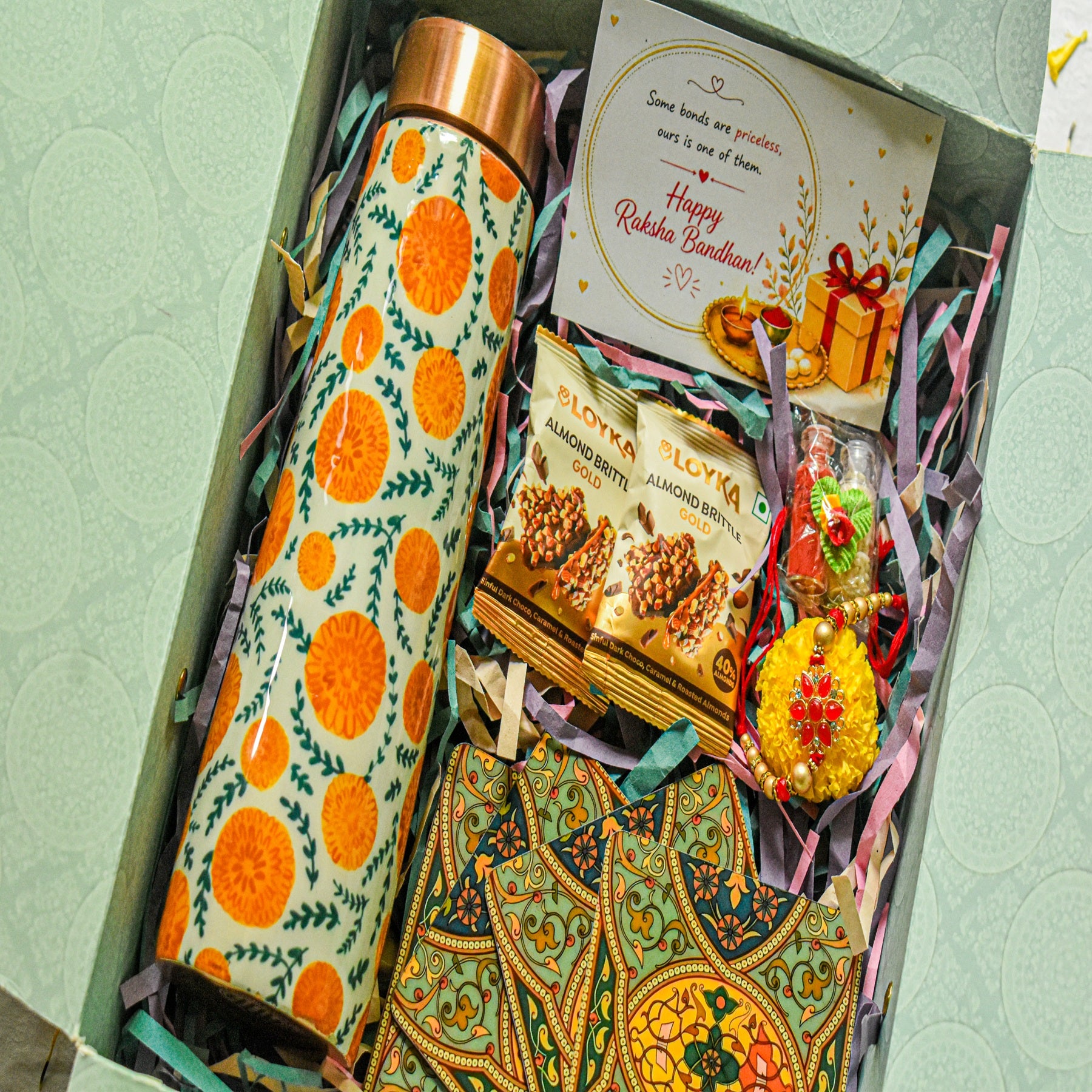Premium Rakhi Gift Box- Marigold Copper Bottle +MDF Coaster Flora Set Of 4