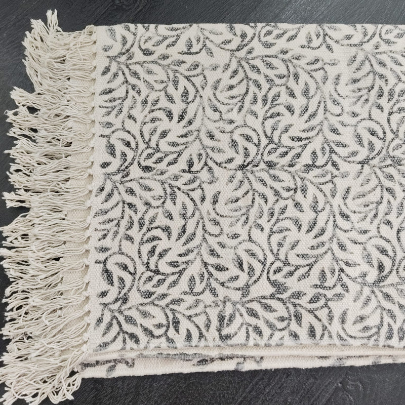 Monochrome Leaf Handwoven Cotton Rug – Black & Ivory with Fringe